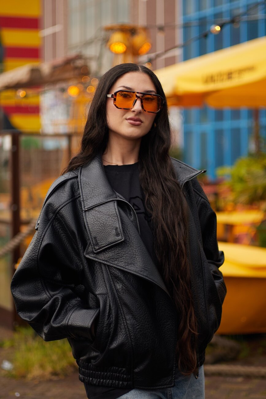 Coreline Creative street portrait with amber glasses