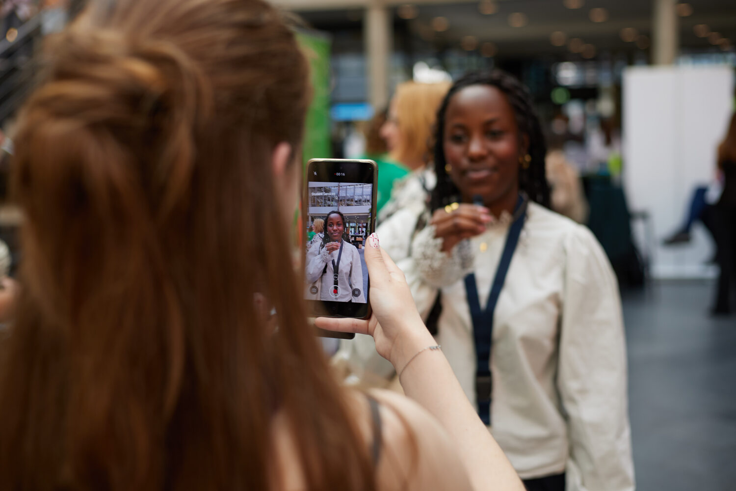 Sharon being filmed during the Youth Peace Summit